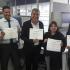 Servidores de la Secretaría Distrital de Planeación sosteniendo sus diplomas